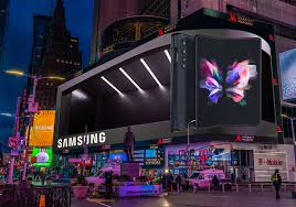 Spectacular 3D anamorphic billboard showing a car emerging from a digital screen in a busy city area.