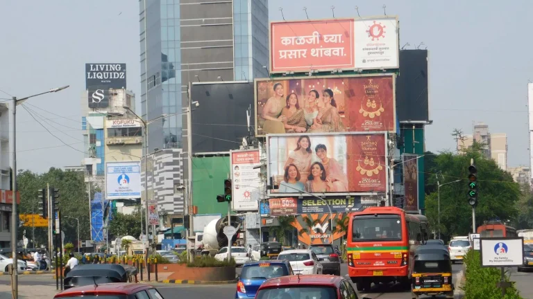Mixed Billboard Cluster (Multi-Brand Hoarding Stack): Dominating Visual Real Estate at Busy Metro Junctions