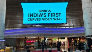 Times OOH curved digital videowall at Manohar International Airport introduces immersive DOOH advertising for brands.
