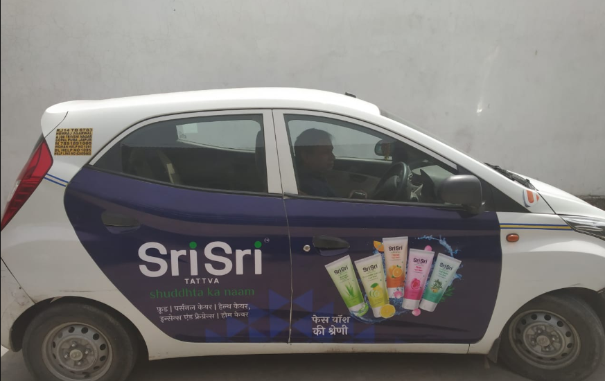 Cab Branding takes OOH Ad Campaign for Sri Sri Tattva to next level !! Transit media like car advertising,bus advertising and Train Branding