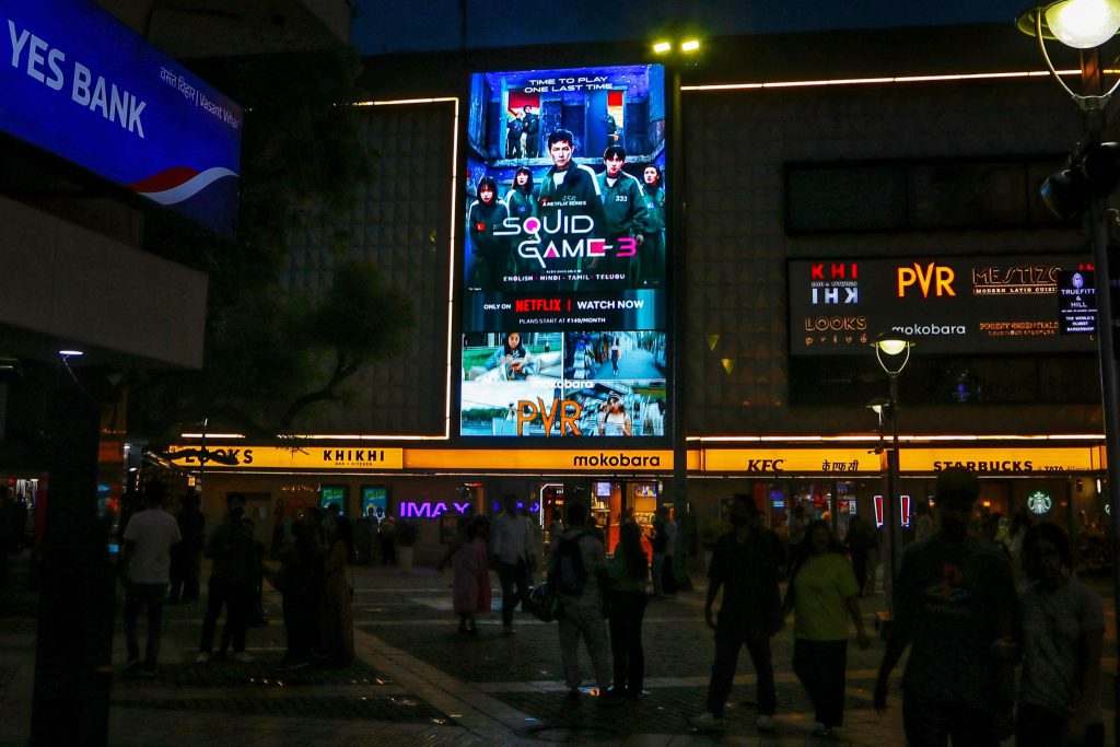 Netflix campaign India, Squid Game Season 3, DOOH advertising Delhi, digital outdoor marketing, entertainment advertising, MyHoardings, Priya Highstreet branding
