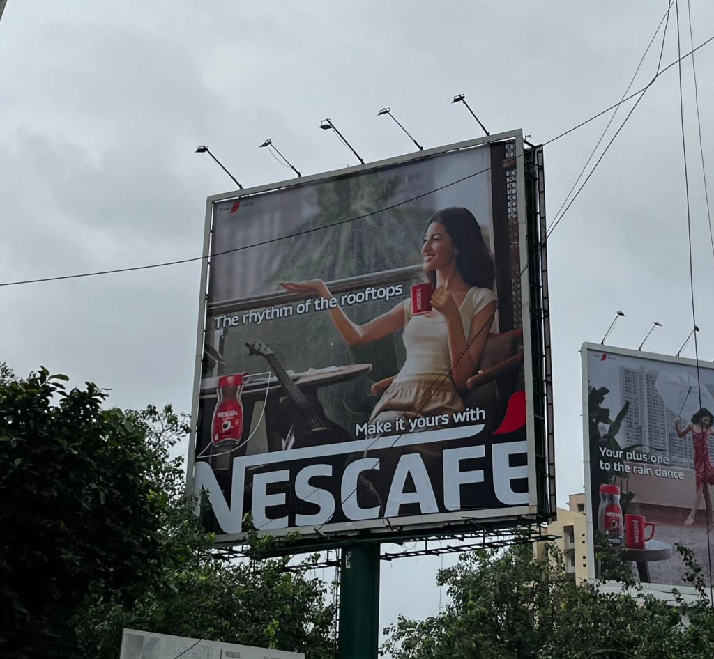 Nescafé campaign, OOH advertising Mumbai, coffee brand promotion, emotional branding, monsoon marketing, MyHoardings, Mumbai outdoor campaign