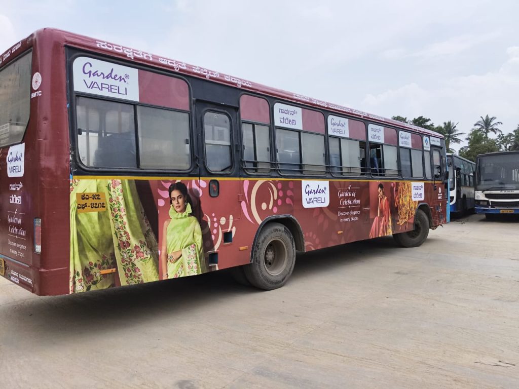 Garden Vareli BMTC bus branding in Bengaluru executed by MyHoardings showcasing elegant fashion brand visuals on moving buses