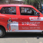 Sharda University’s car wrap ad promotes global learning and diversity through creative OOH transit advertising.